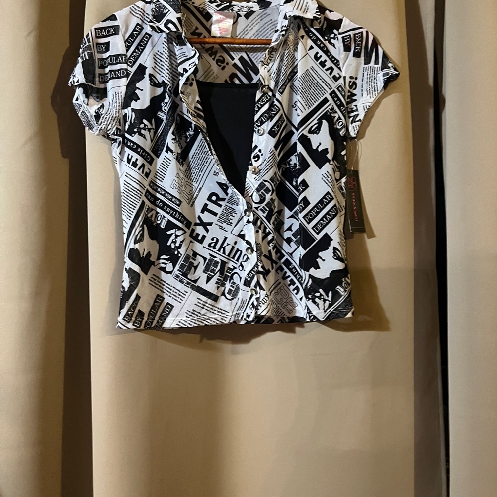 Button down graphic shirt over a black short tank top